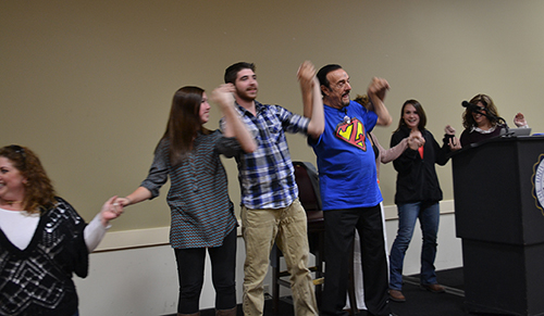 Zimbardo holding hands with students2